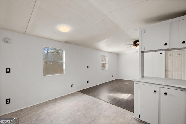 interior space with light wood-type flooring and ceiling fan