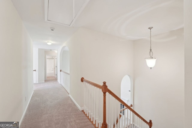 corridor with light carpet