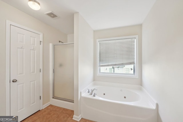 bathroom with tile patterned flooring and plus walk in shower