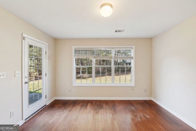 empty room featuring dark hardwood / wood-style floors