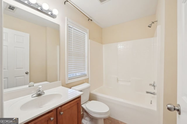 full bathroom featuring shower / washtub combination, vanity, and toilet