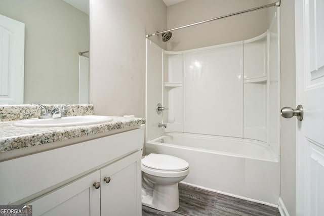 full bathroom featuring hardwood / wood-style flooring, vanity, toilet, and shower / washtub combination