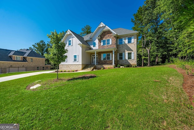 view of front of property with covered porch and a front yard