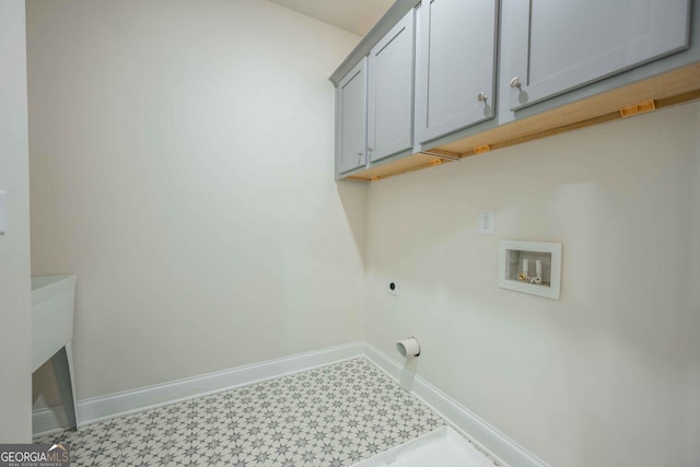 laundry area with cabinets, hookup for a washing machine, and electric dryer hookup