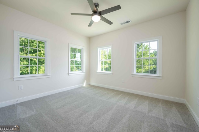 carpeted empty room with ceiling fan