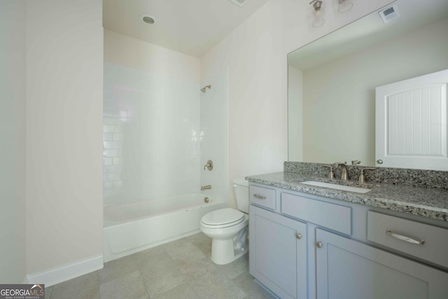 full bathroom with vanity, tiled shower / bath combo, toilet, and tile patterned flooring