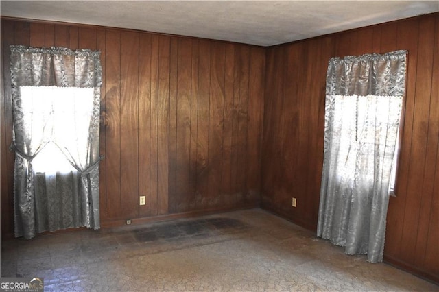 empty room with wooden walls