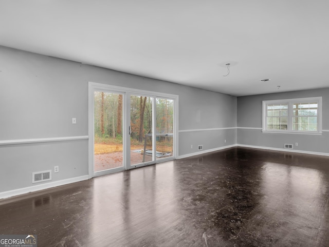 unfurnished room featuring dark wood-type flooring