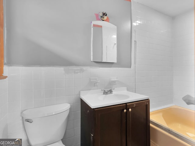 full bathroom featuring tile walls, vanity,  shower combination, and toilet