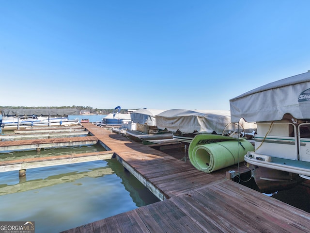 view of dock with a water view