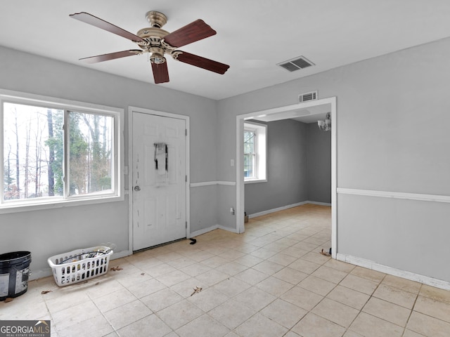 foyer featuring ceiling fan and light tile patterned flooring