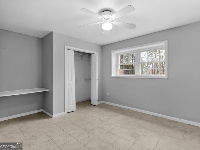 unfurnished bedroom with light tile patterned floors, a closet, and ceiling fan