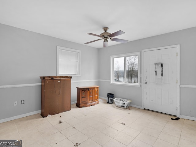 entrance foyer featuring ceiling fan