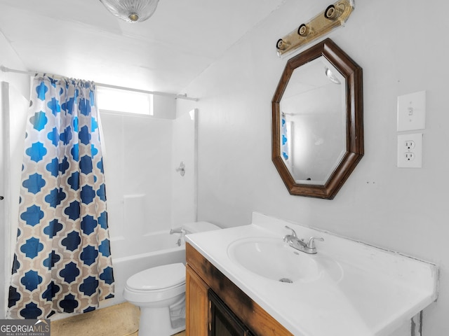 full bathroom with vanity, shower / tub combo, and toilet