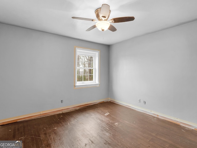 unfurnished room with ceiling fan and hardwood / wood-style flooring