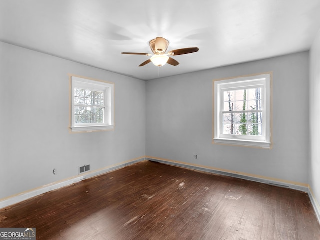 unfurnished room with dark hardwood / wood-style floors