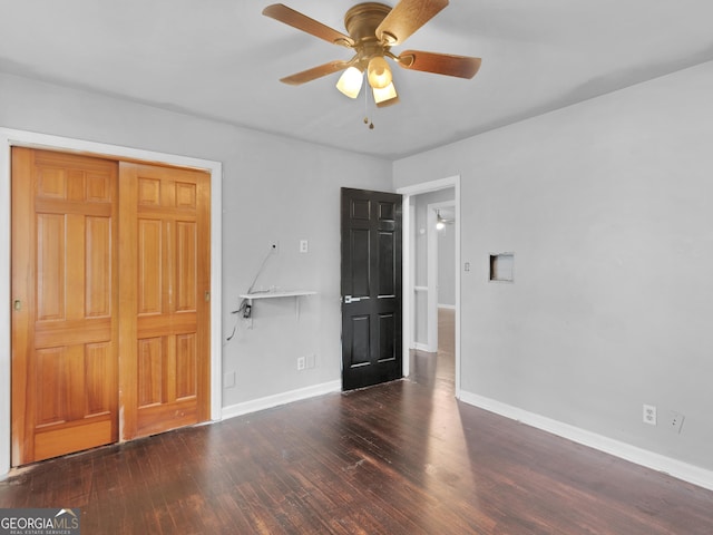 unfurnished bedroom featuring ceiling fan, a closet, and dark hardwood / wood-style floors