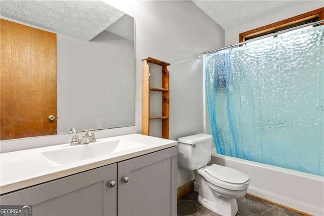 full bathroom featuring vanity, shower / bath combo, tile patterned floors, toilet, and a textured ceiling