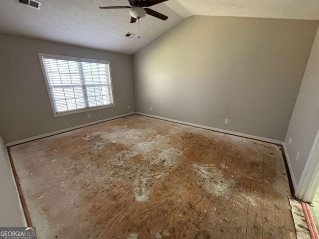 unfurnished room featuring ceiling fan, lofted ceiling, and a textured ceiling