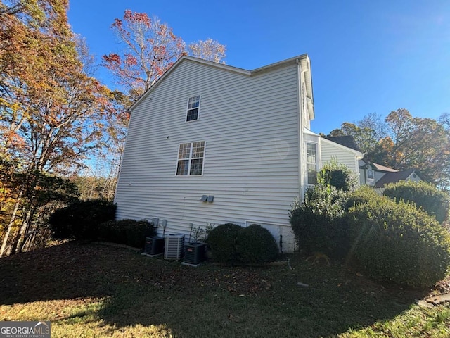 view of side of property with central AC