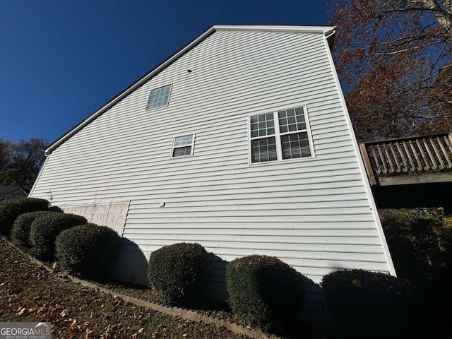 view of property exterior featuring a deck