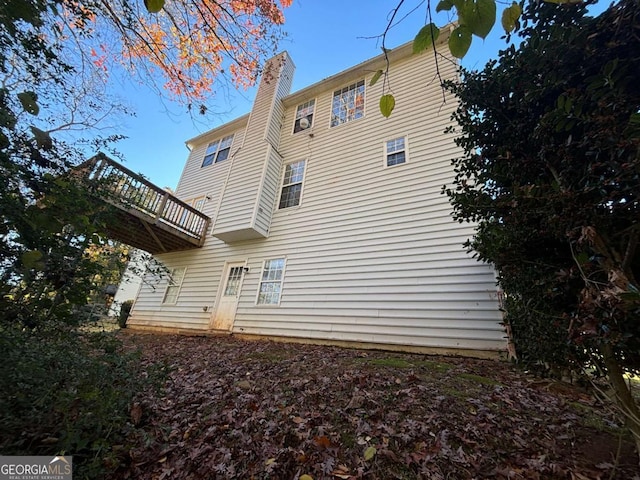 back of property featuring a balcony