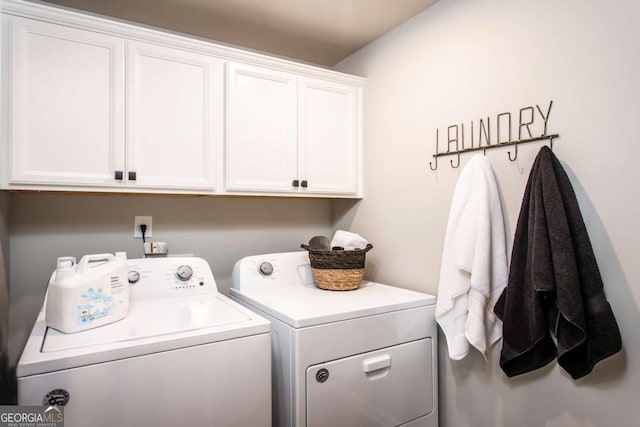 washroom with cabinets and independent washer and dryer