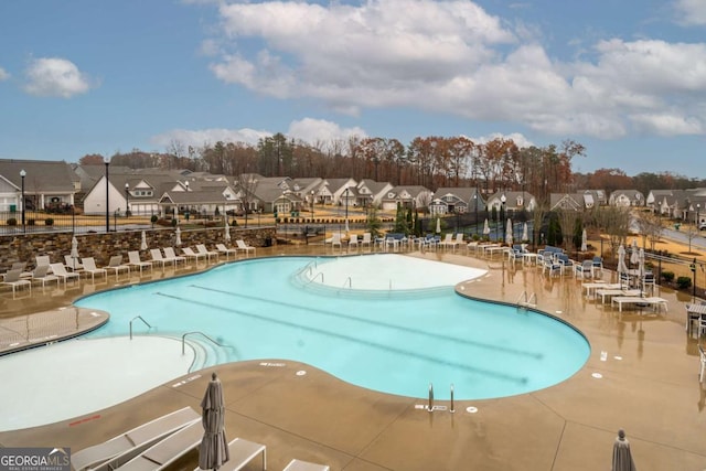 view of swimming pool with a patio area