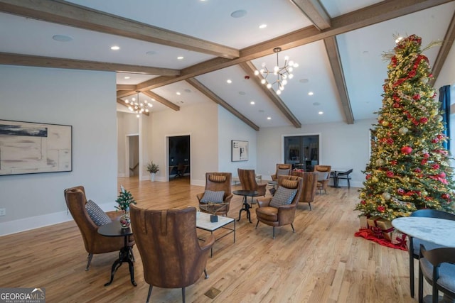 living room featuring high vaulted ceiling, beamed ceiling, a chandelier, and light wood-type flooring