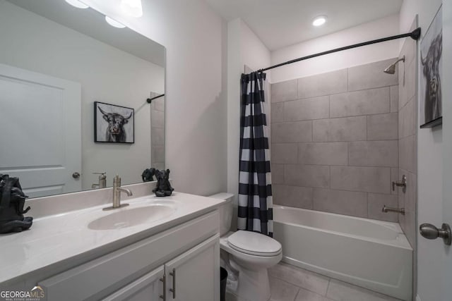 full bathroom featuring toilet, tile patterned floors, vanity, and shower / tub combo with curtain