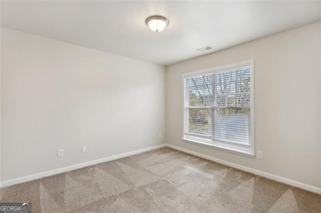 empty room with light colored carpet