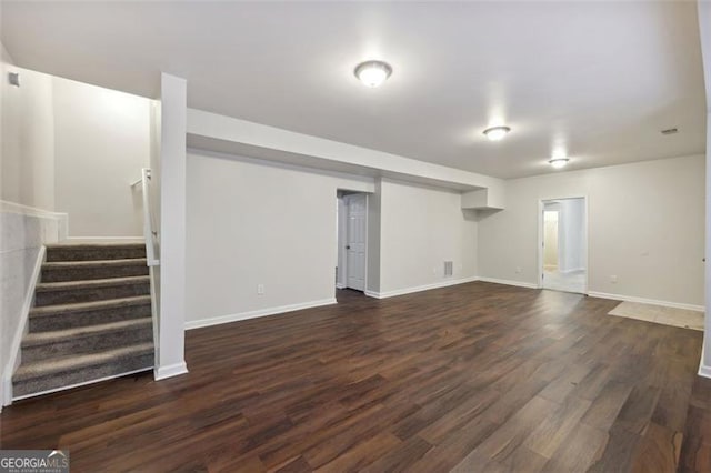 basement featuring dark hardwood / wood-style floors