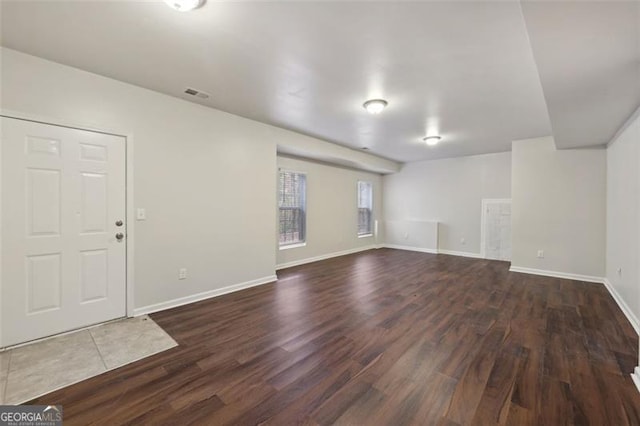 interior space with dark hardwood / wood-style flooring