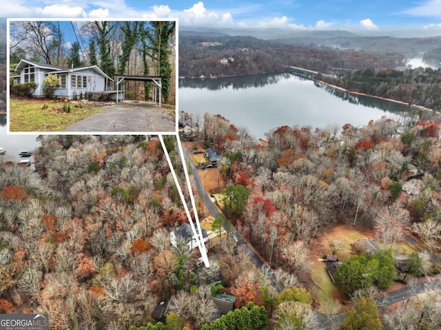 birds eye view of property featuring a water view