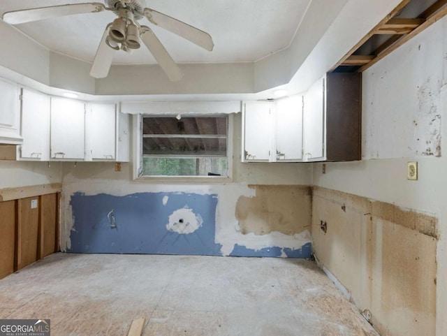 kitchen featuring white cabinetry and ceiling fan