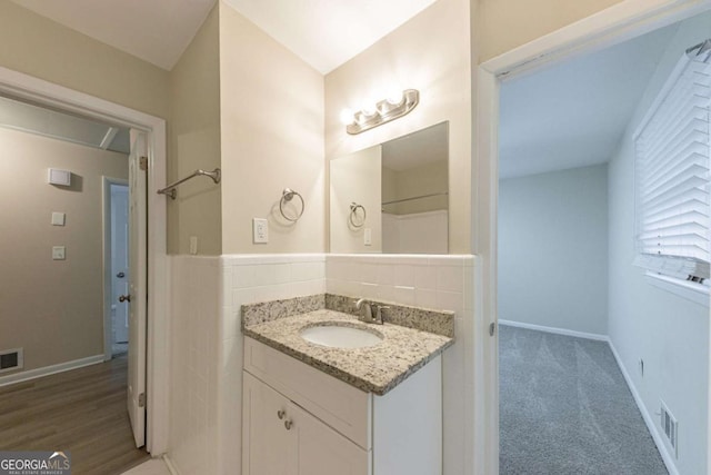 bathroom featuring vanity and hardwood / wood-style flooring