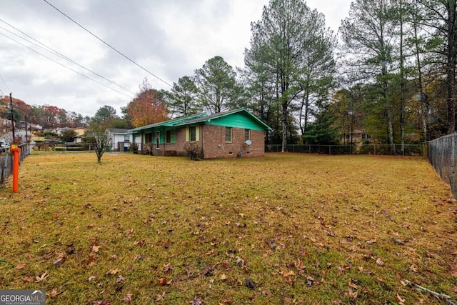 ranch-style home with a garage and a front yard