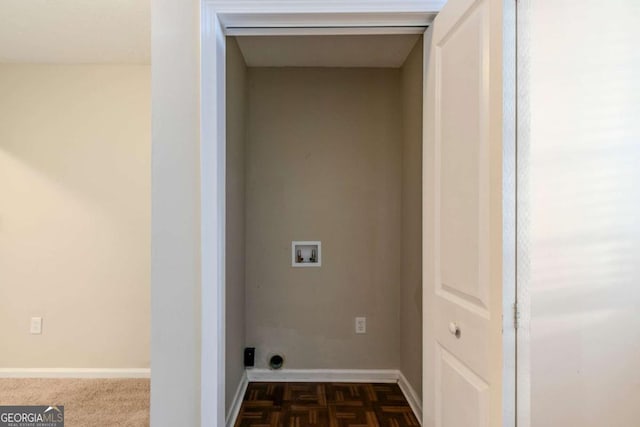 laundry area with hookup for a washing machine and dark parquet flooring