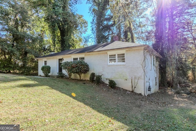 view of home's exterior featuring a yard