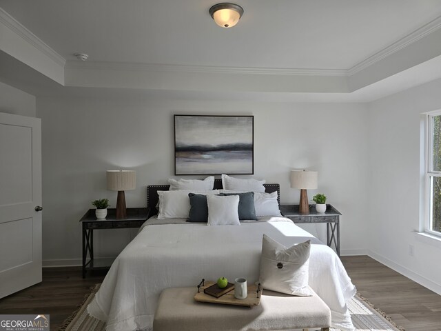 bedroom featuring dark hardwood / wood-style floors and ornamental molding