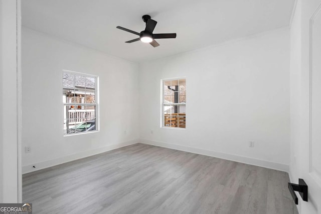 spare room featuring ceiling fan and light hardwood / wood-style flooring