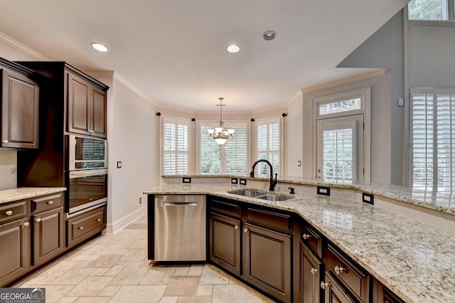 kitchen with sink, decorative light fixtures, dark brown cabinets, appliances with stainless steel finishes, and ornamental molding