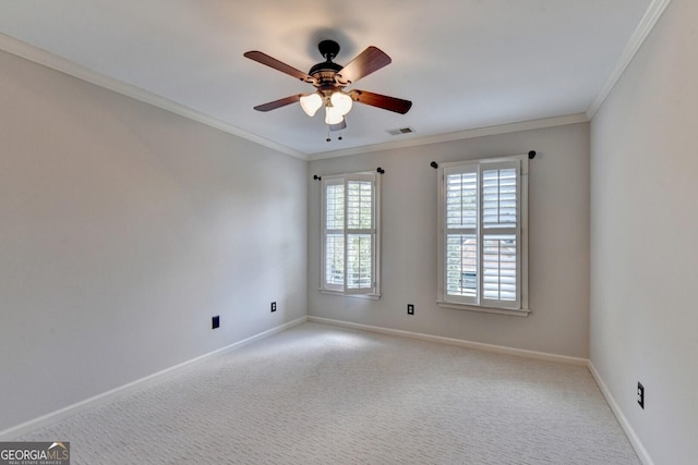 spare room featuring light carpet and ornamental molding