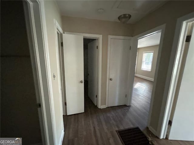 hallway featuring dark wood-type flooring