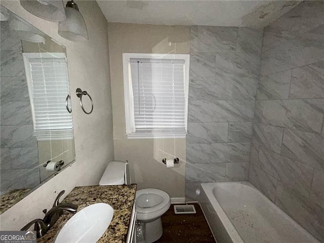 bathroom featuring vanity and toilet