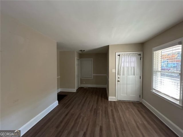 interior space with dark wood-type flooring