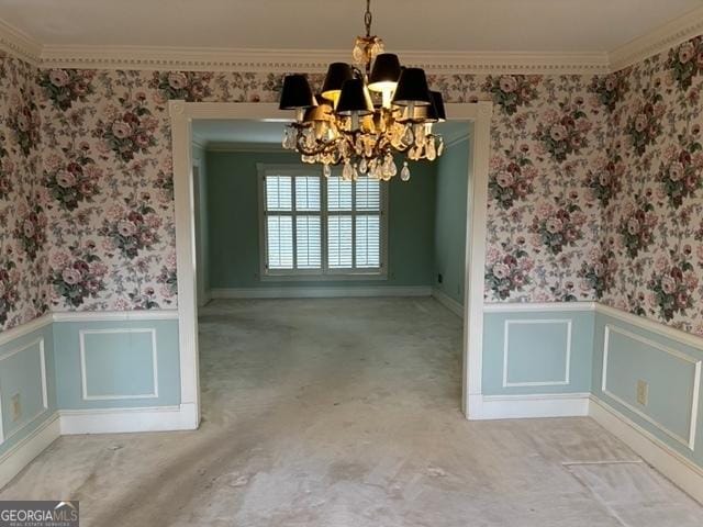 unfurnished dining area with light carpet, ornamental molding, and an inviting chandelier