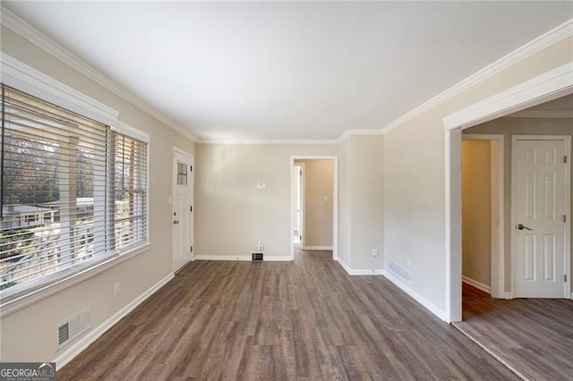 unfurnished room featuring crown molding and dark wood-type flooring