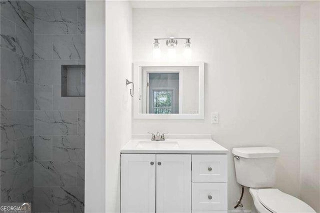 bathroom with vanity and toilet