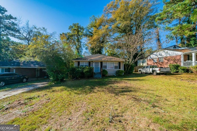 ranch-style home with a front yard